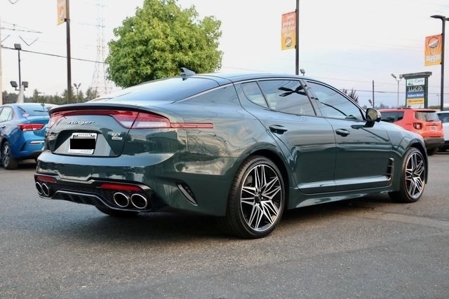 Photo of a green 2022 Kia Stinger three-quarter rear